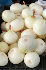 Peeled onions on sale at the market.