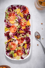 Blood orange, golden beet, radicchio, and frisee (endive) salad with pistachios.