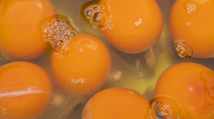 Background image of egg yolk in a bowl.