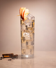 cocktail with liquor, apples and cinnamon