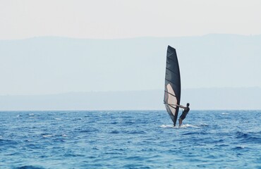  WIndsurfer surfing on  sea blue water