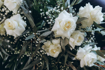 Boho style wedding bouquet of white roses. 