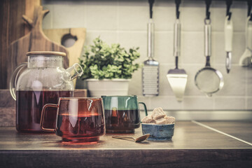 Fototapeta na wymiar Glass teapot full of black tea