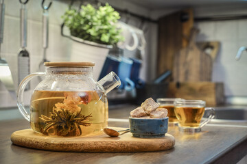 Blooming flowering tea in glass teapot