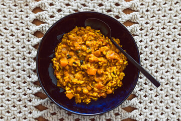 vegan pumpkin risotto with almond and spinach, healthy plant-based food