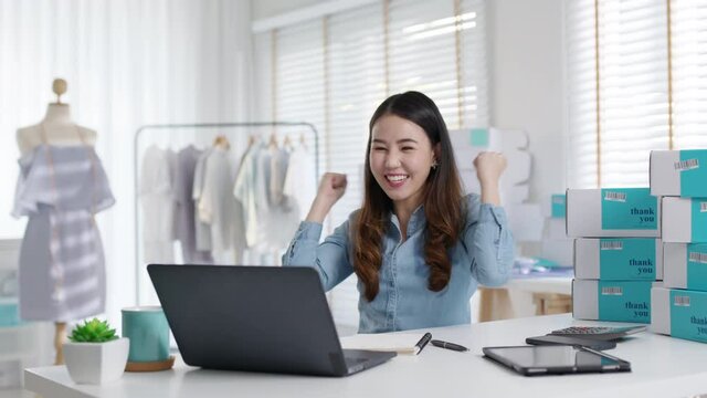 Young attractive beautiful female entrepreneur fund borrower crazy joyful ecstatic face gesture hand yes feeling amazed in peer to peer P2P lending finance or crowdfunding network microfinance approve