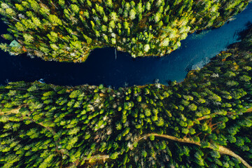 Aerial view of green forests and blue lakes and rivers in summer Finland