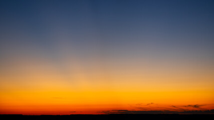 Vibrant and colorful minimalistic landscape. Scenic view of the dramatic sky during sunset. Empty place for text