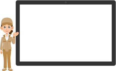 横置きのタブレットPCの前で案内する作業着を着た女性
