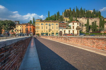 Verona, Italy, 07.04.2019: view from Ponte Pietra bridge to Castle San Pietro in the sunny afternoon