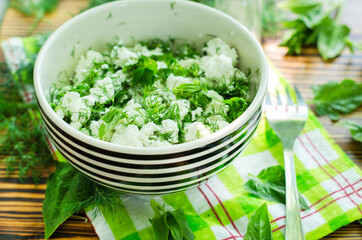 Fresh cottage cheese with spinach and herbs