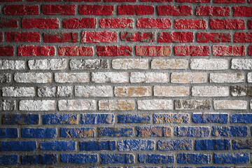 National flag of Netherlands. depicting in paint colors on an old brick wall. Flag  banner on brick wall background.