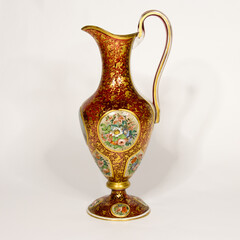 Ornately decorated and painted antique red glass vase