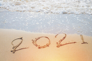 Happy New Year 2021 is coming concept sandy tropical ocean beach lettering