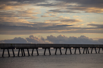Fototapeta premium Sunrise view of the famous 6km long sugar cane jetty at Lucinda in Far North Queensland, Australia