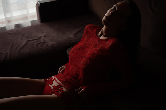 Dreamy alluring woman in red lingerie