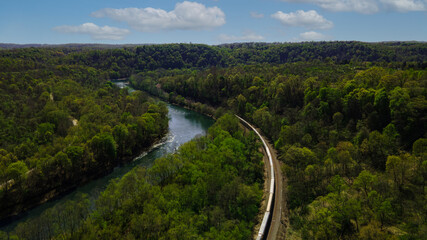 Aerial Over The River With Train