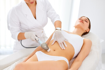 Woman getting laser hair removal procedure