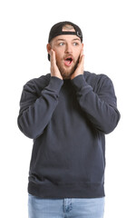 Shocked handsome man on white background