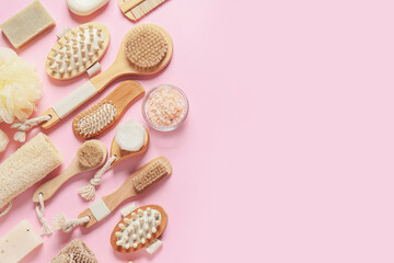 Composition with massage brushes and bath supplies on color background
