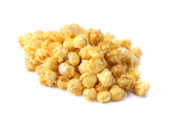 A pile of delicious caramel popcorn isolated on a white background.