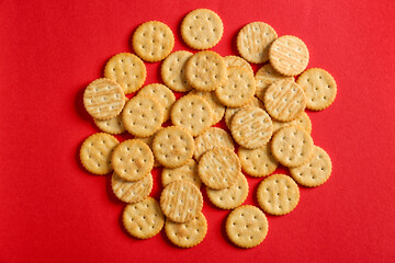 Tasty crackers on color background