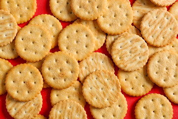 Tasty crackers on color background
