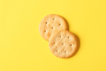 Tasty crackers on color background