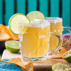 Mexican alcohol cocktail chelada with light beer and lime juice