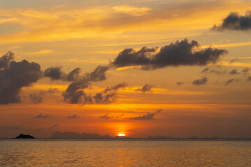 Beautiful sunset over the sea water on the island of Koh Phangan, Thailand