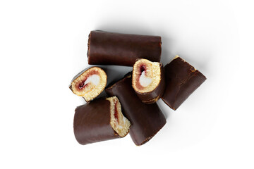 Chocolate glazed cake rolls with berry jam isolated on white background. Top view.