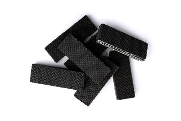 Black wafers isolated on white background. Top view.