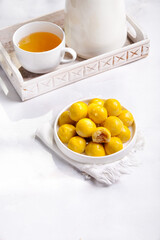 Nastar is pineapple tart cookies isolated on marble white background. Indonesian popular cookies during Eid Mubarak.