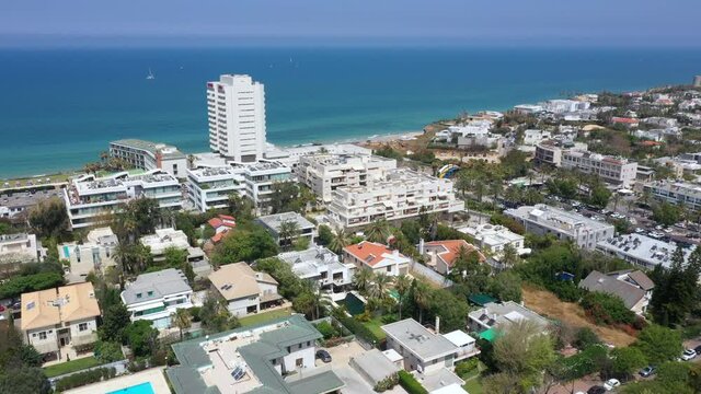 Aerial view of Herzliya coastline, with waterfront hotels and Herzliya Pituah houses.