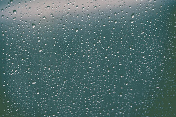 Raindrops or vapor trough window glass 