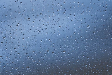 Raindrops or vapor trough window glass 