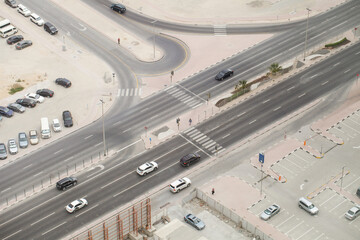 Roadway, motorway, cars on the road, intersection with traffic lights, top view.