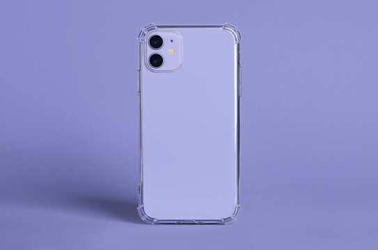 Purple iPhone 11 in clear silicone case back view isolated on purple background. Phone case mockup