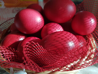 eggs red in a basket easter background