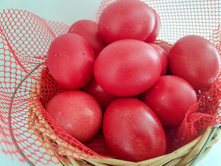 eggs red in a basket easter background