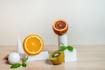 Citrus still life concept with lemon,lime and orange on white stands and podiums over white background, horizontal
