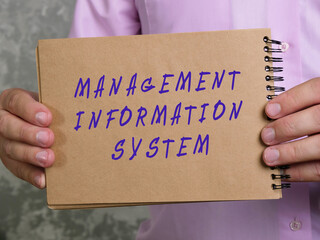 Financial concept meaning MANAGEMENT INFORMATION SYSTEM with inscription on the page.