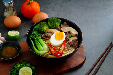 Asian Noodle Soup beef, boiled spaghetti noodles, cooked egg, vegetables home made.