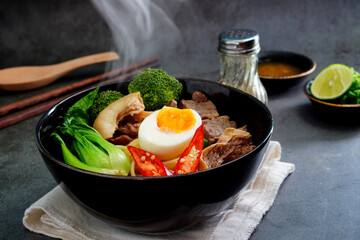 Asian Noodle Soup beef, boiled spaghetti noodles, cooked egg, vegetables home made.
