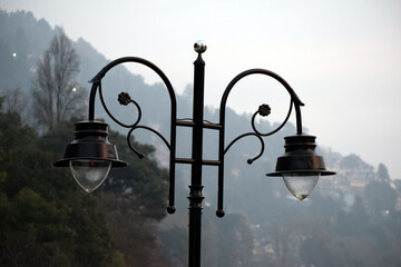 Beautiful picture of black road side lamp in india. Background Blur