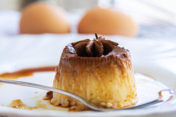 delicious egg custard with caramel on white plate