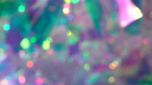 Soft pastel neon pink blue purple silver crystal lights bokeh. Luxury background for party. Blurred holographic holiday lights. Posterized Abstract Effect