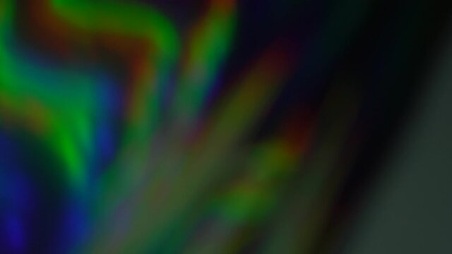 The aurora effect. Light rays. Rainbow lights glow in the dark. Abstract Holiday Psychedelic Digital Modern Neon Background. Wave vibrations