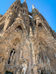 Low angle view of Nativity Facade of the Sagrada Familia, Barcelona, Spain. Architect Antoni Gaudi.