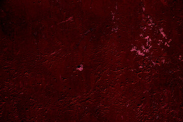 Crimson colored wall background with textures of different shades of crimson red